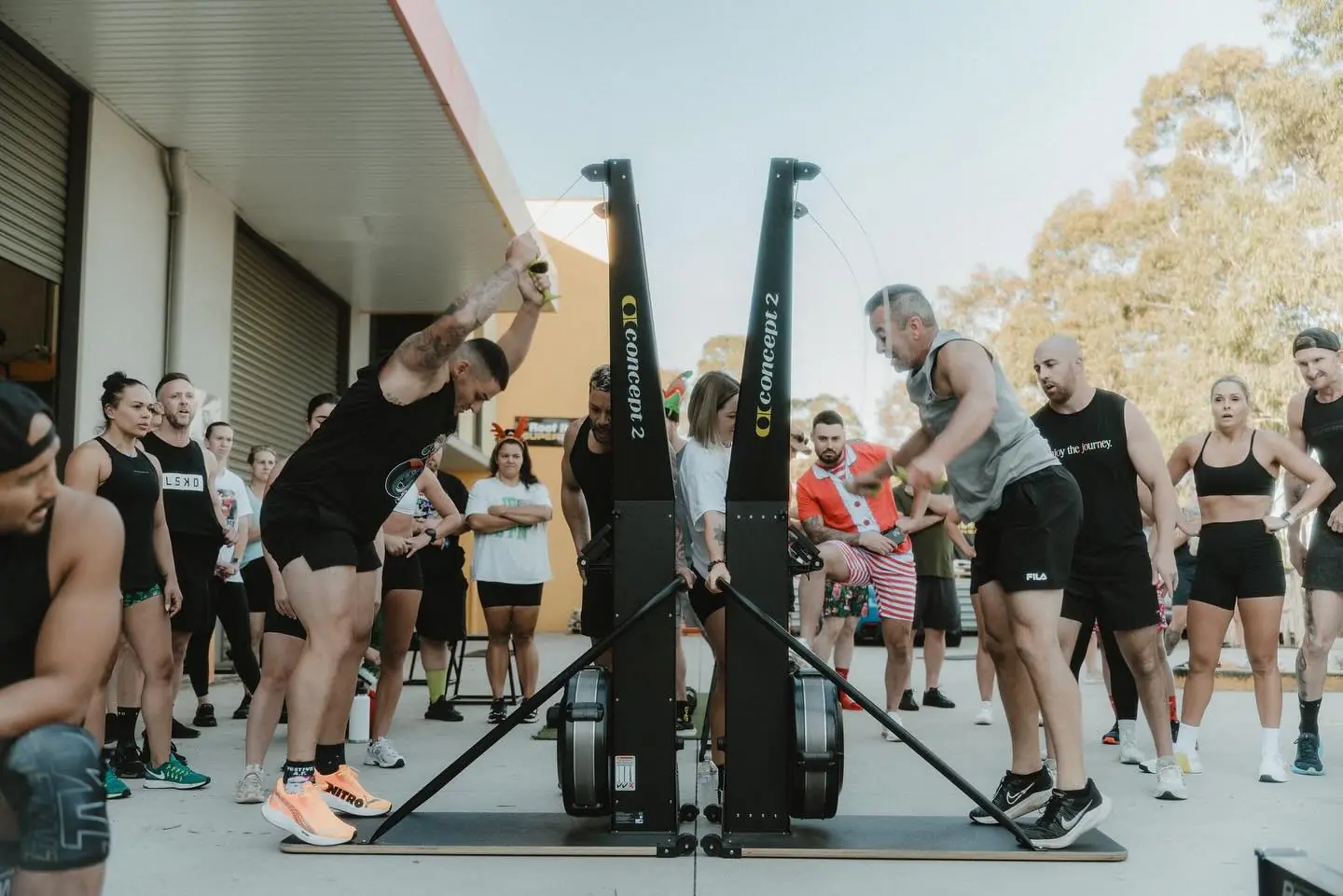 Members racing a relay outside the studio